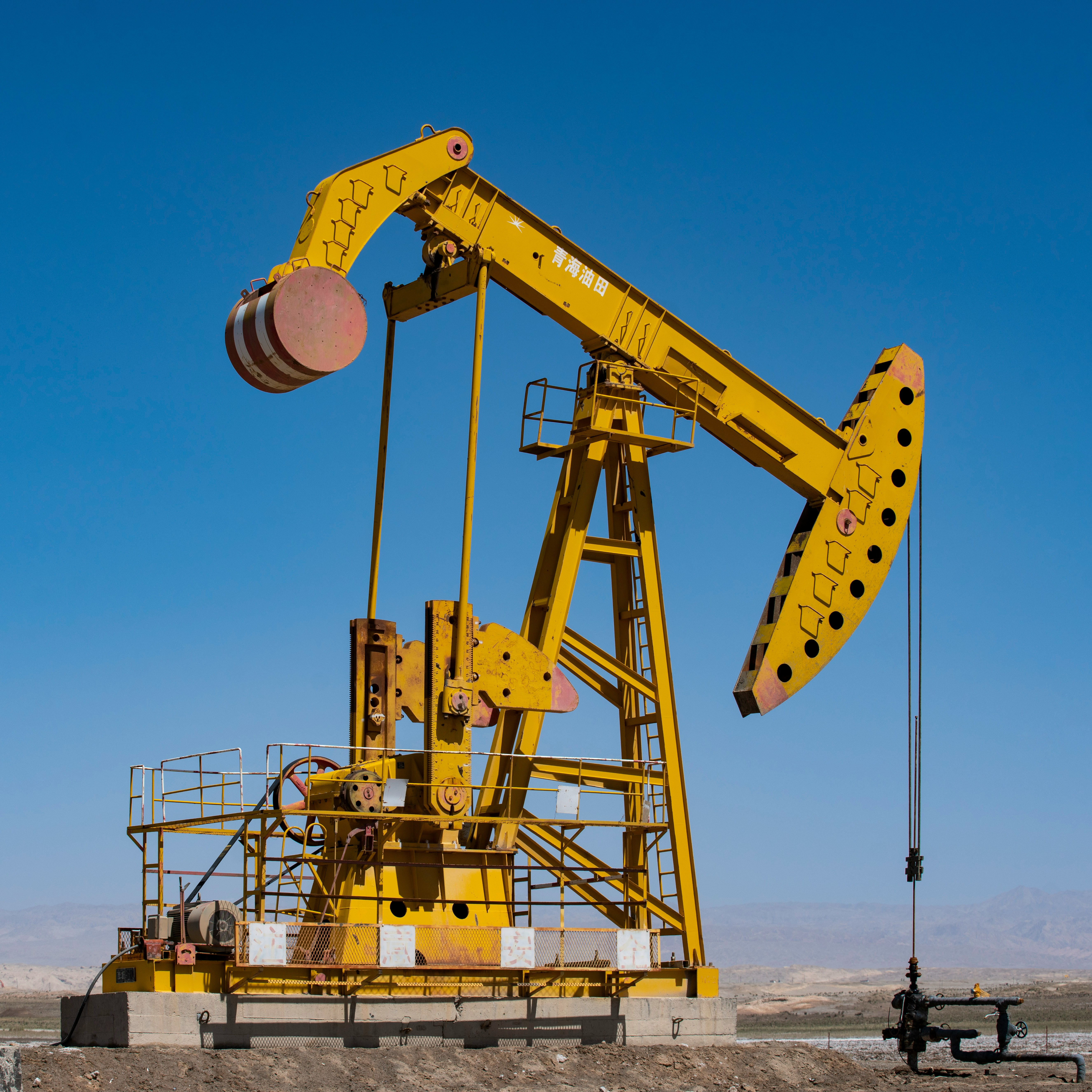 Photo by Jeanson Wong on Unsplash Oil pumpjack in the field